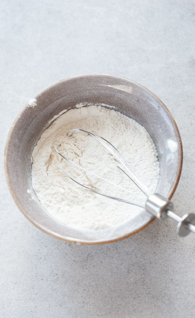 dry ingredients for lemon ricotta pancakes in a bowl