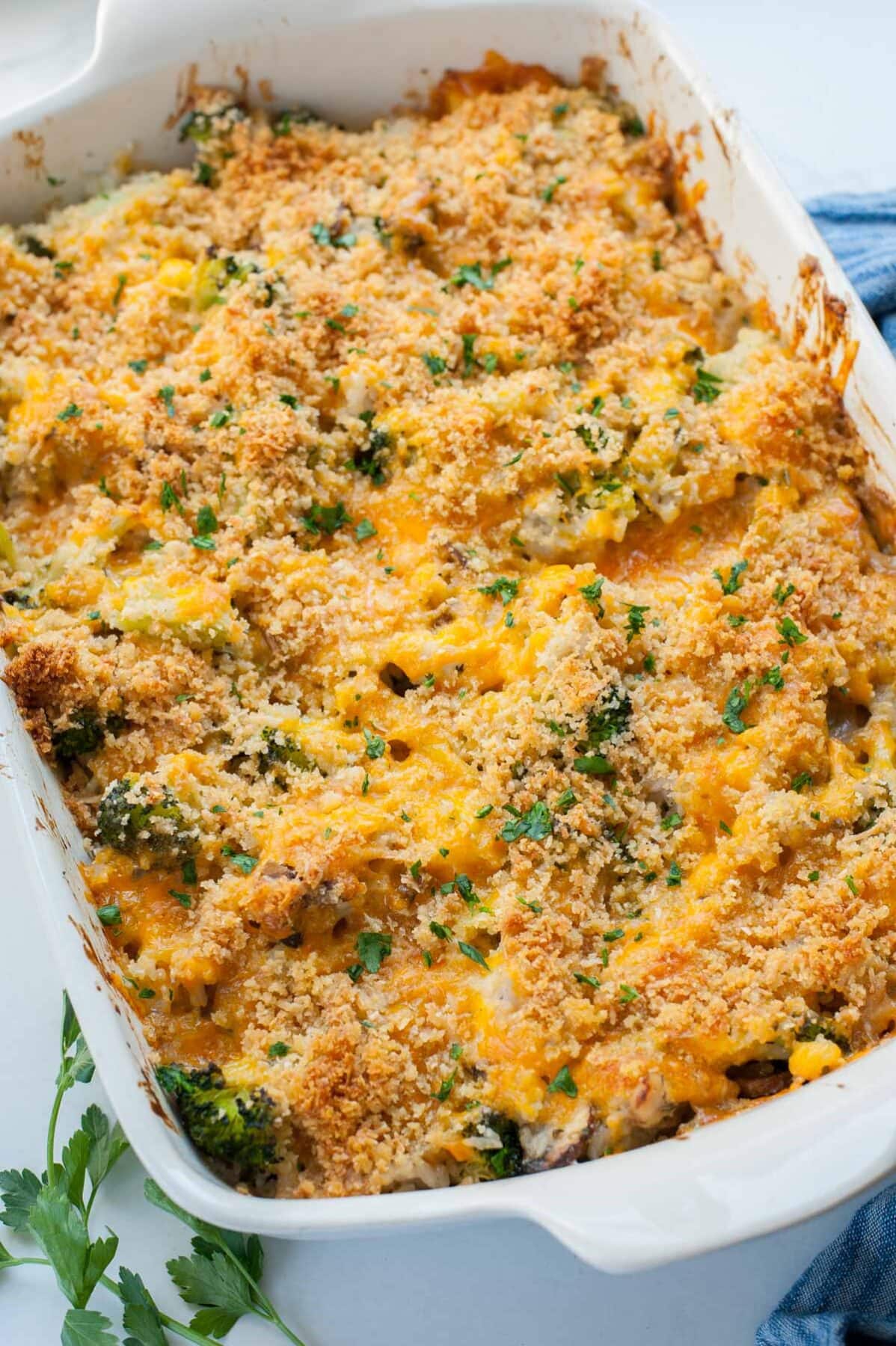 Chicken broccoli rice casserole in a white baking dish.