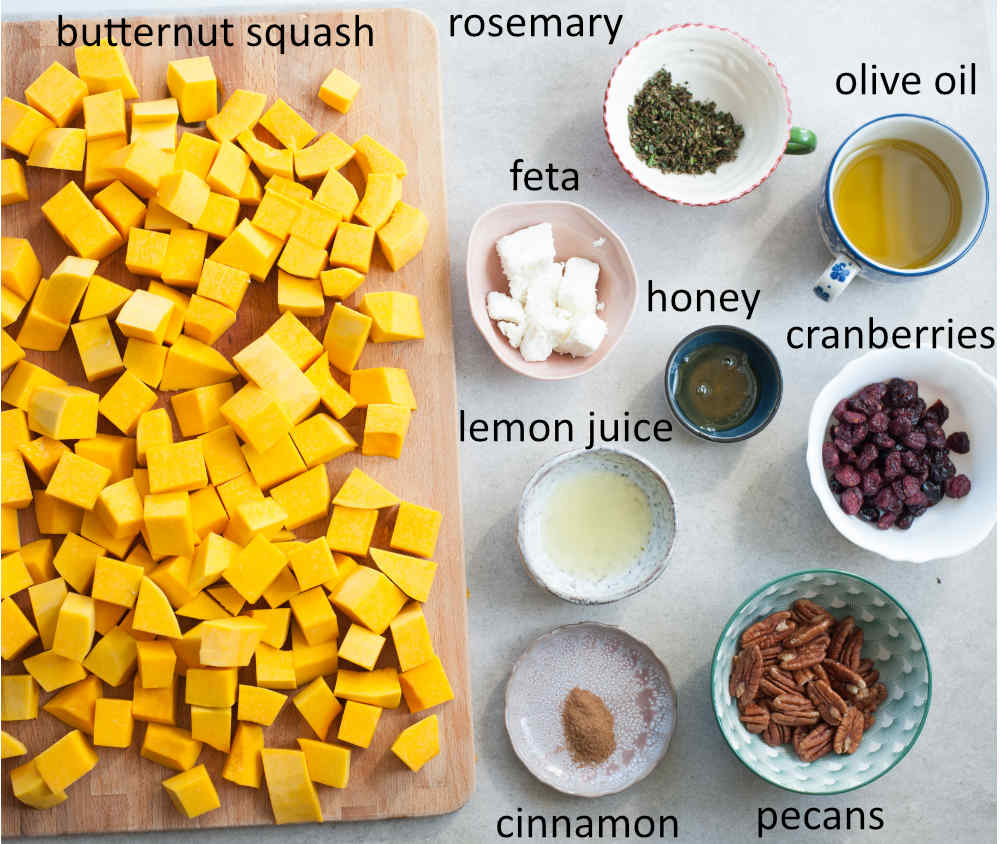 ingredients needed to prepare roasted butternut squash with cranberries, rosemary, pecans, and feta