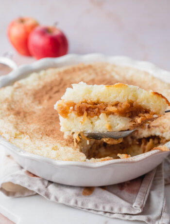 Polish rice with apples in a casserole dish.