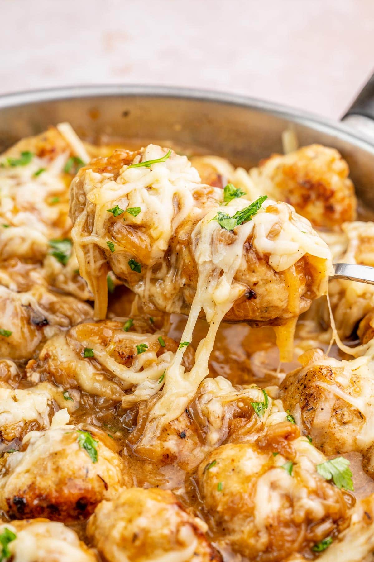 French onion meatballs in a pan.