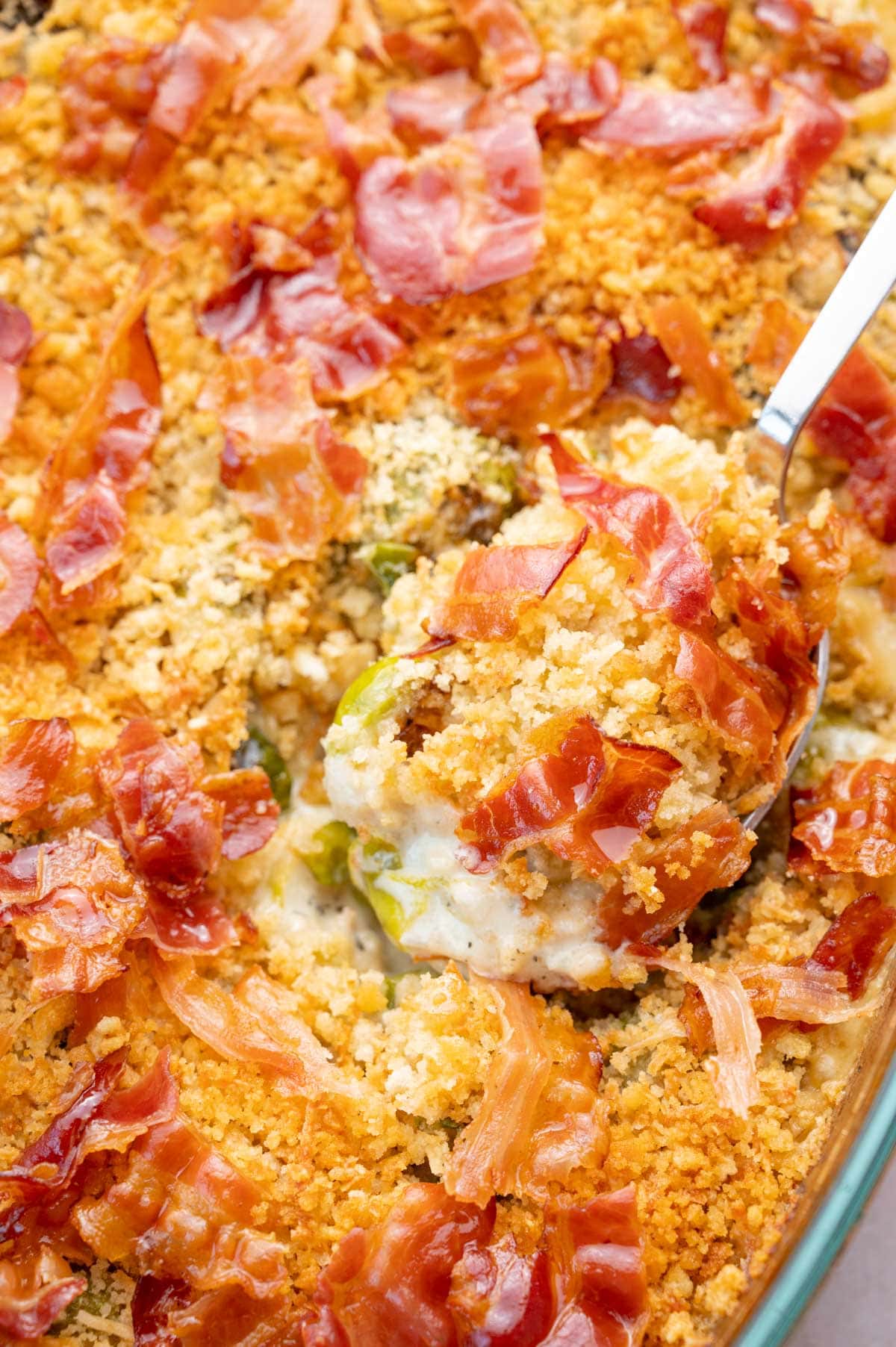 A close-up photo of Brussels sprouts gratin in a baking dish.