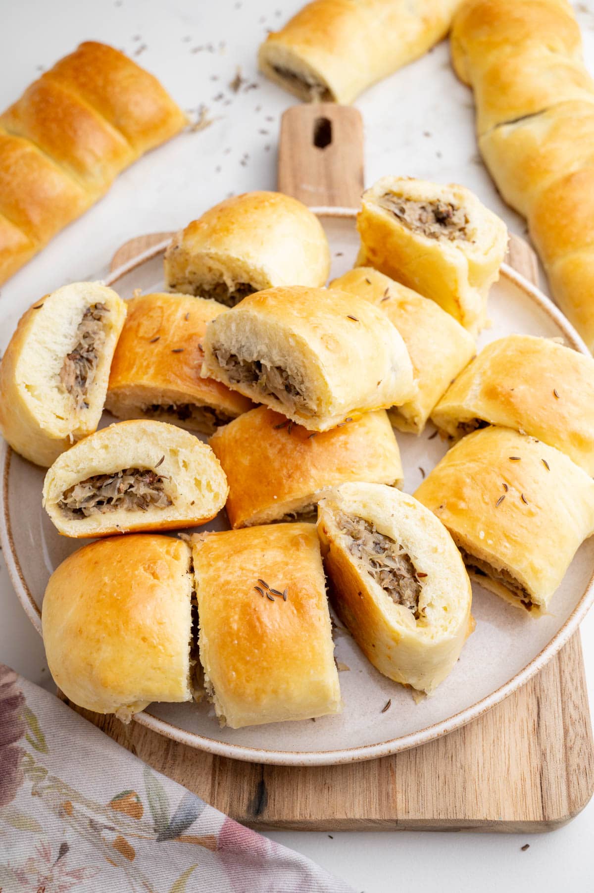Sauerkraut and Mushroom Buns on a beige plate.