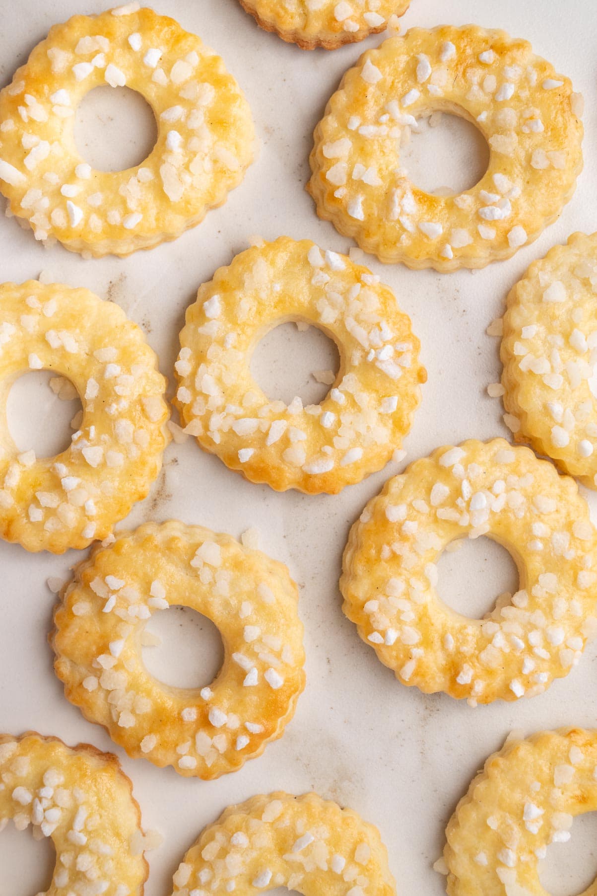 Saure-Sahne-Kringel (German Sour Cream Cookies) on a marble counter.