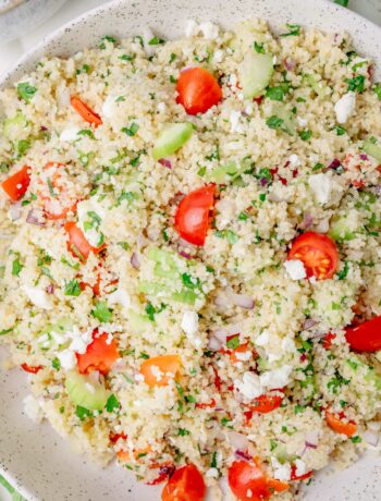 Couscous salad in a white bowl.