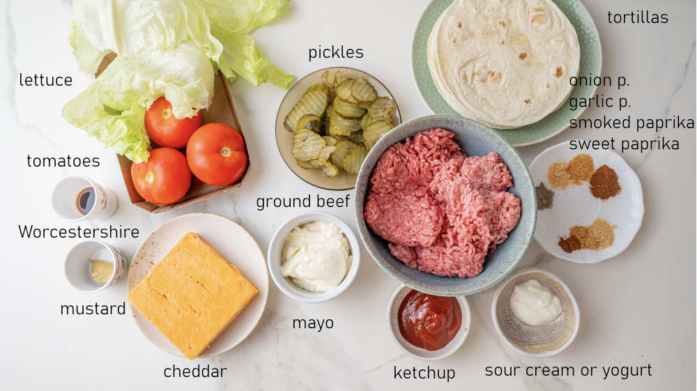 Labeled ingredients for big mac tacos.